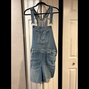Medium-wash distressed overall shorts!